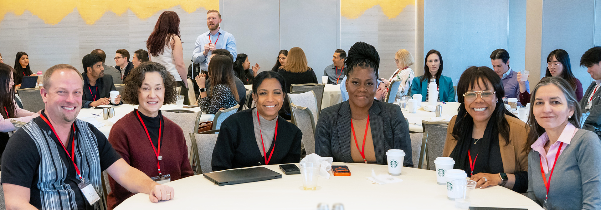 a group of colleagues pose for a photo during a workshop break