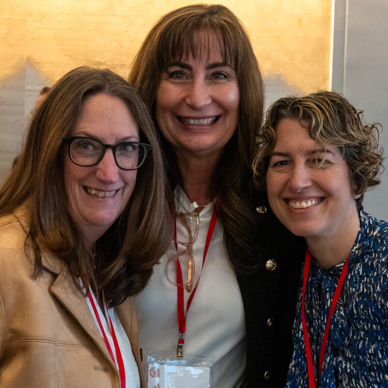 a group of colleagues pose for a photo during a workshop break