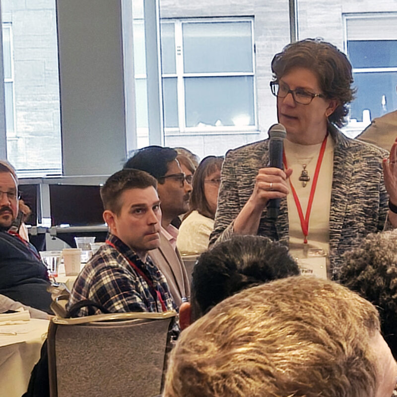 an audience member addresses colleagues chat during a workshop