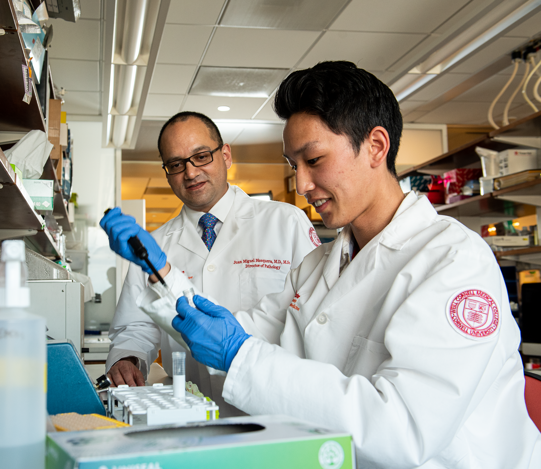 A professor and student work in a medical lab