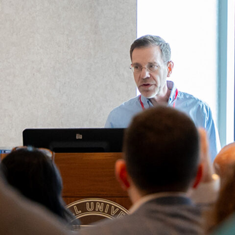 Curt Cole speaks to a large audience