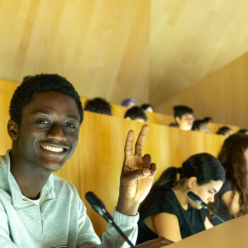 Students take notes in a lecture hall