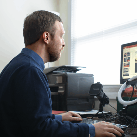 faculty working at computer